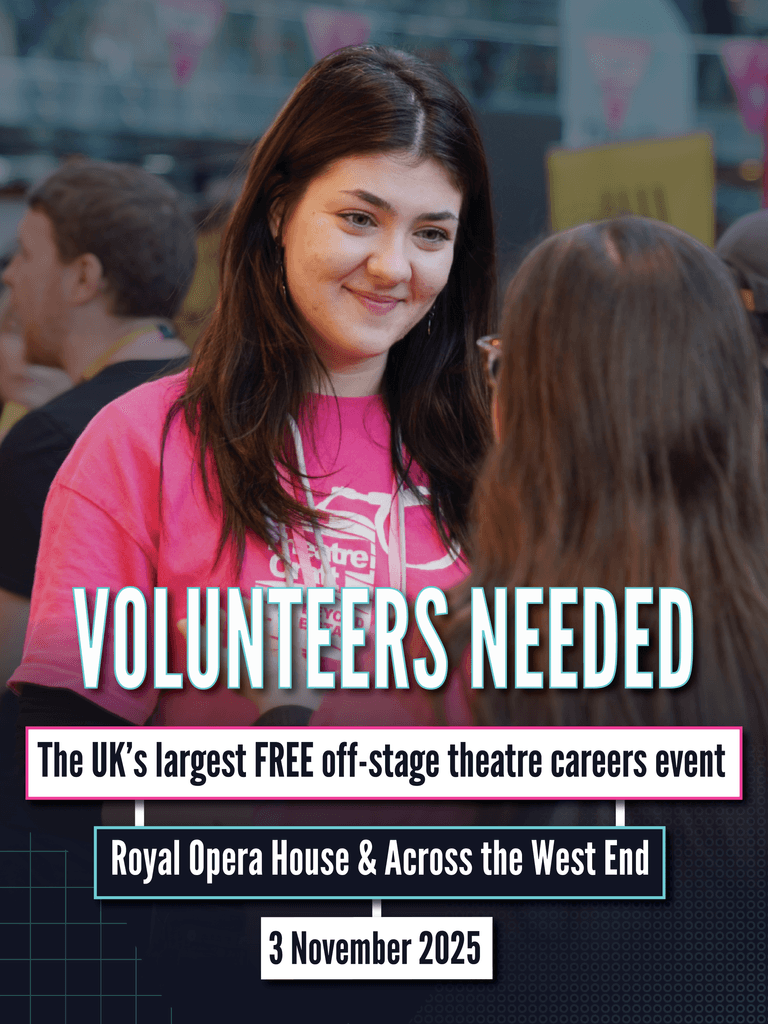 A smiley young woman in a bright pink TheatreCraft t-shirt faces another young person with their back to the camera.