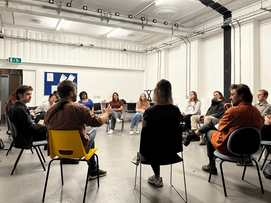 A group of masterclass members in a circle discussing The Bounds by Stewart Pringle 