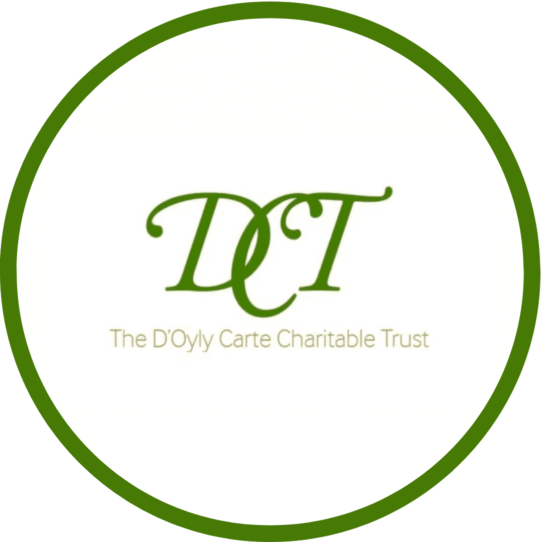 The logo for the Doly Care Charitable Trust featuring their green emblem and a green circle surrounding the emblem and charity name.