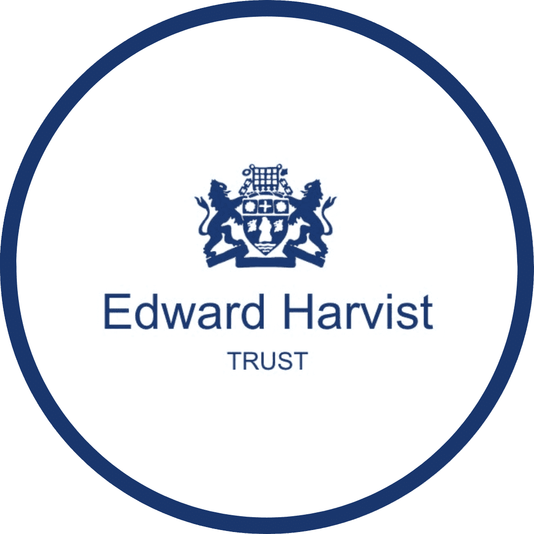 The Edward Harvist Trust logo, showcasing a unique blue emblem. The charity name is also in blue beneath the emblem, all surrounded by a blue circle.