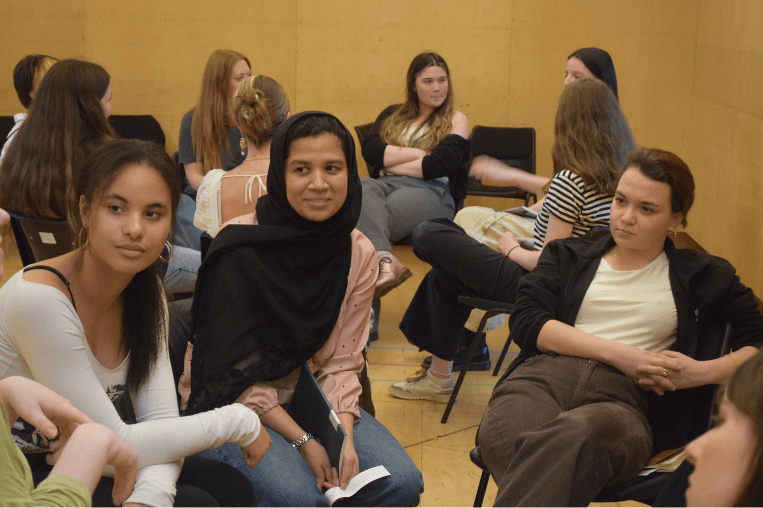 A photo of members together in small groups discussing Machinal by Sophie Treadwell script in Script Social session