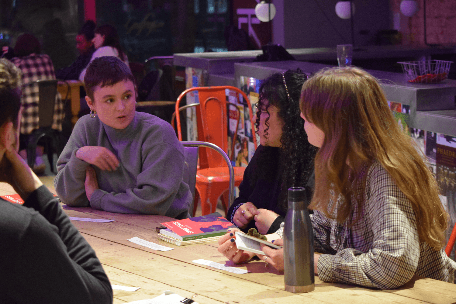 A small group of Masterclass members discussing Shifters by Benedict Lombe