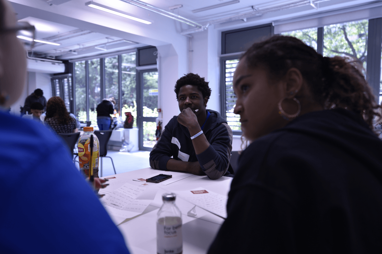 A young person from Avenues Youth group listening to a director in a Start Your Script workshop