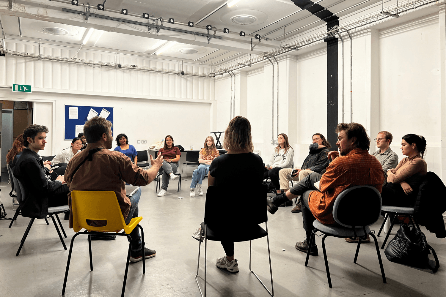 A group of masterclass members in a circle discussing The Bounds by Stewart Pringle 